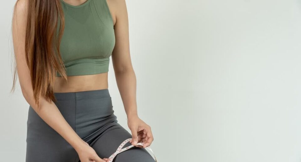 A young woman performing a leg workout at home to Lose Thigh Fat Fast and Easily, focusing on toning and strengthening her thighs.