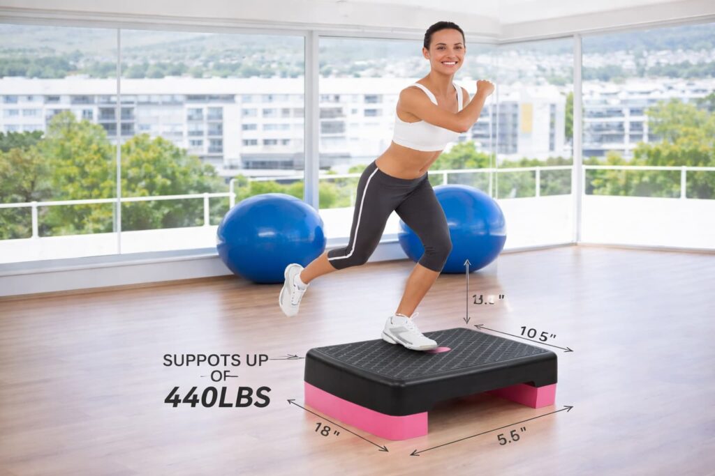 Woman exercising on Fitvids 18-inch adjustable aerobic stepper platform with non-slip surface and 440 lbs weight capacity.